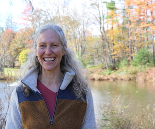 Picture of Aimee Trumbore in front of a lake