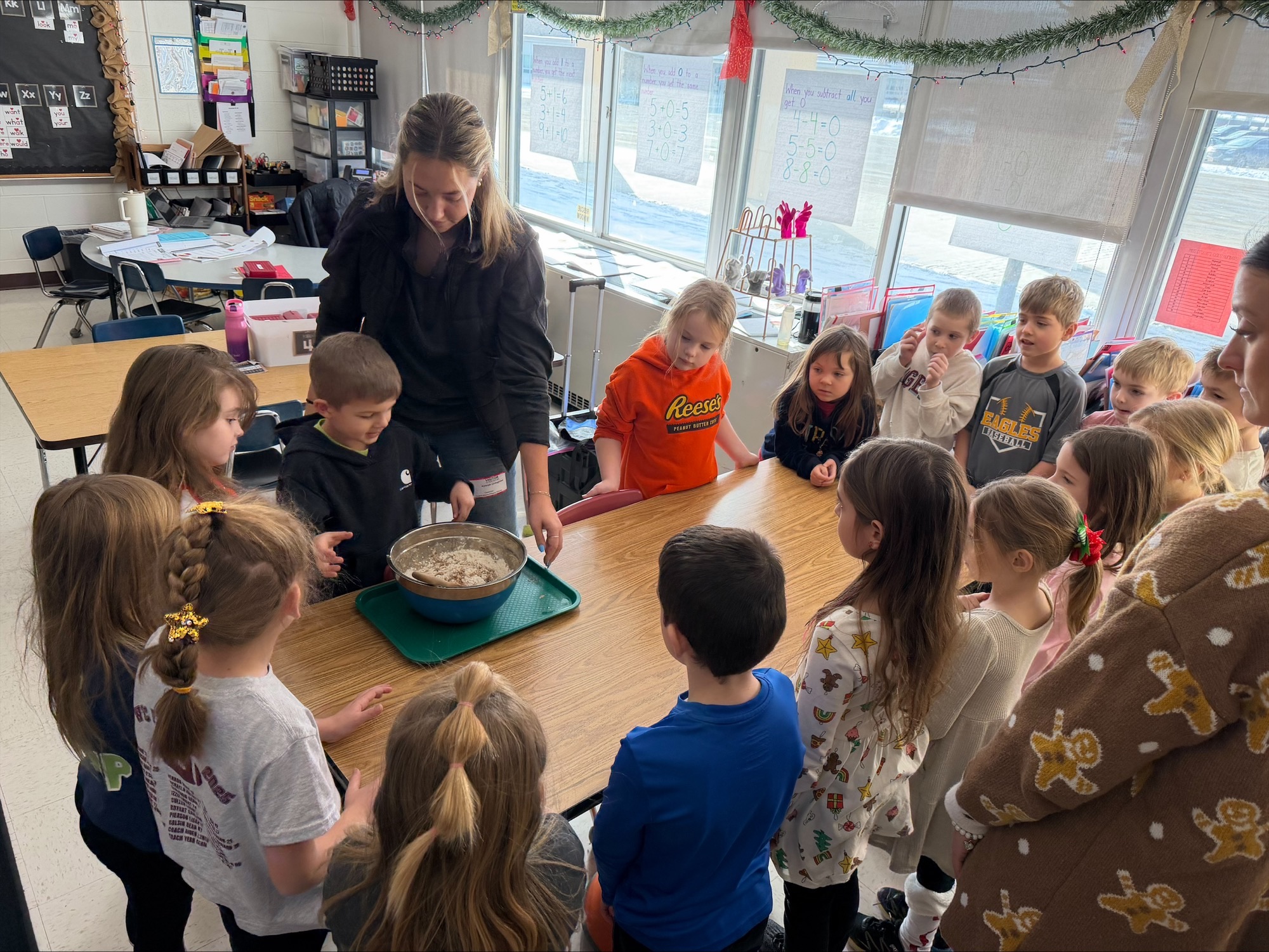 A group of children learning how to make gingerbread dough