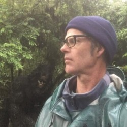 Picture of Michael Murphy in front of greenery