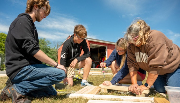 Students working on a construction project for Community Schools