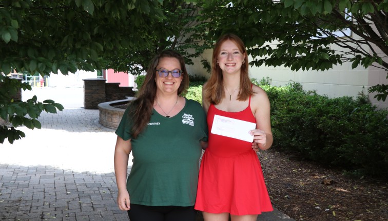 2025 Master Gardener Scholarship awardee, Ella Pons (right), with Master Gardener Coordinator, Courtney Churchill (left)
