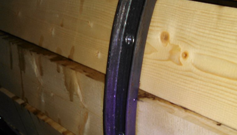 Metal band along the outside of the barrel on a root barrel washer.