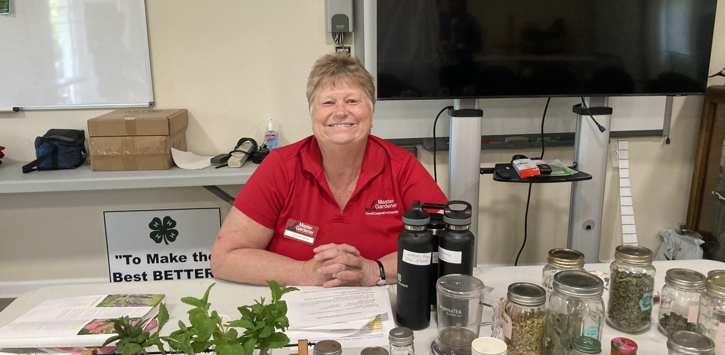Master Gardener manning a table.