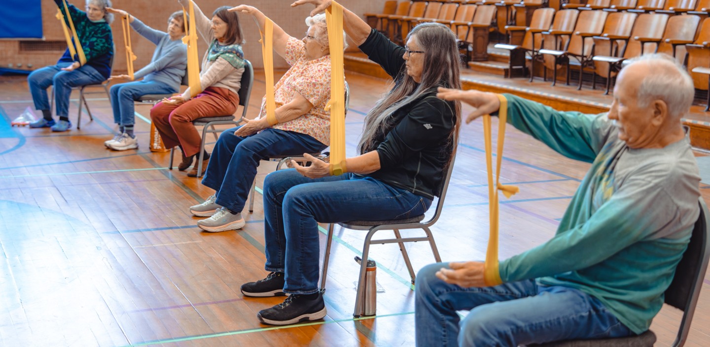 Seniors exercise in an auditorium 