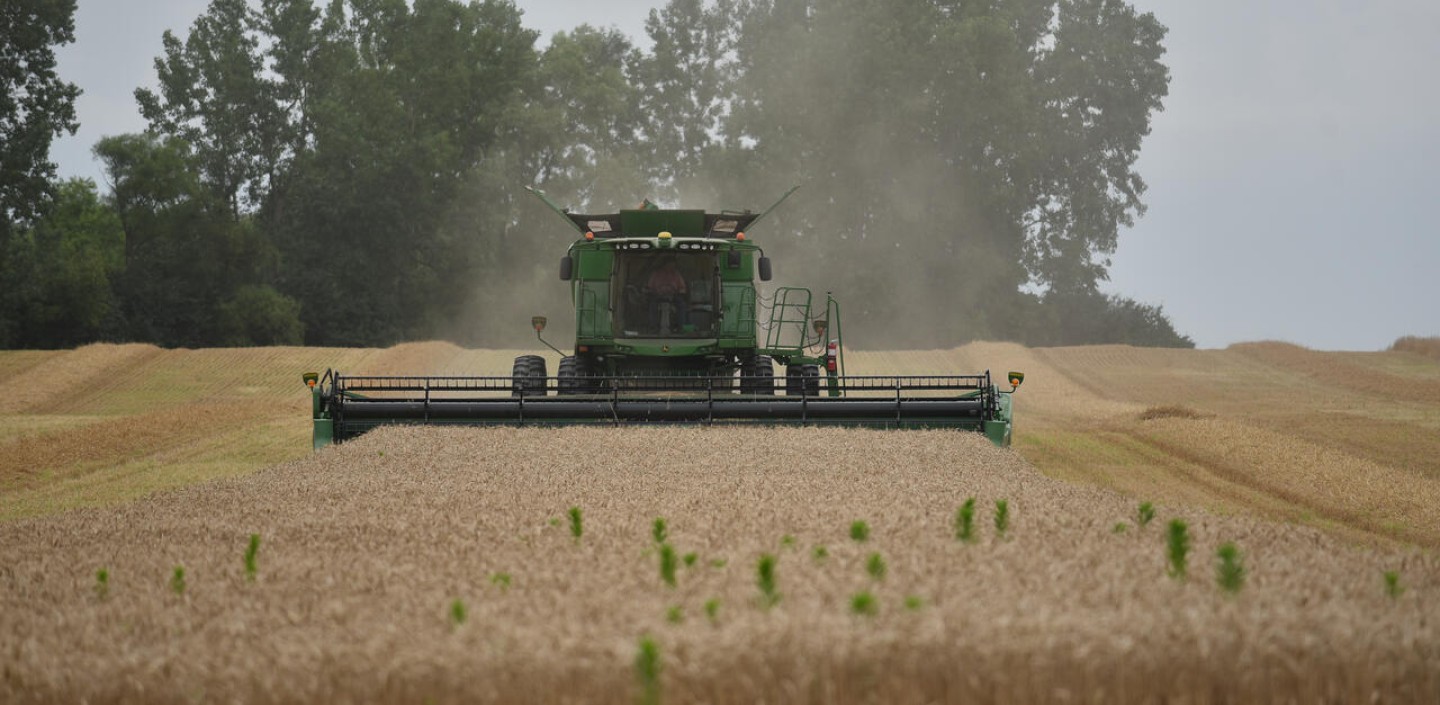 A man operating a hay bailer 