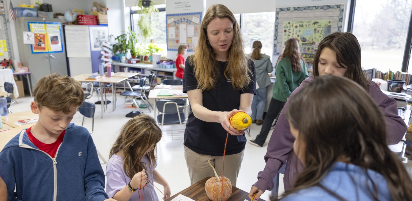 educator and kids learning about squash