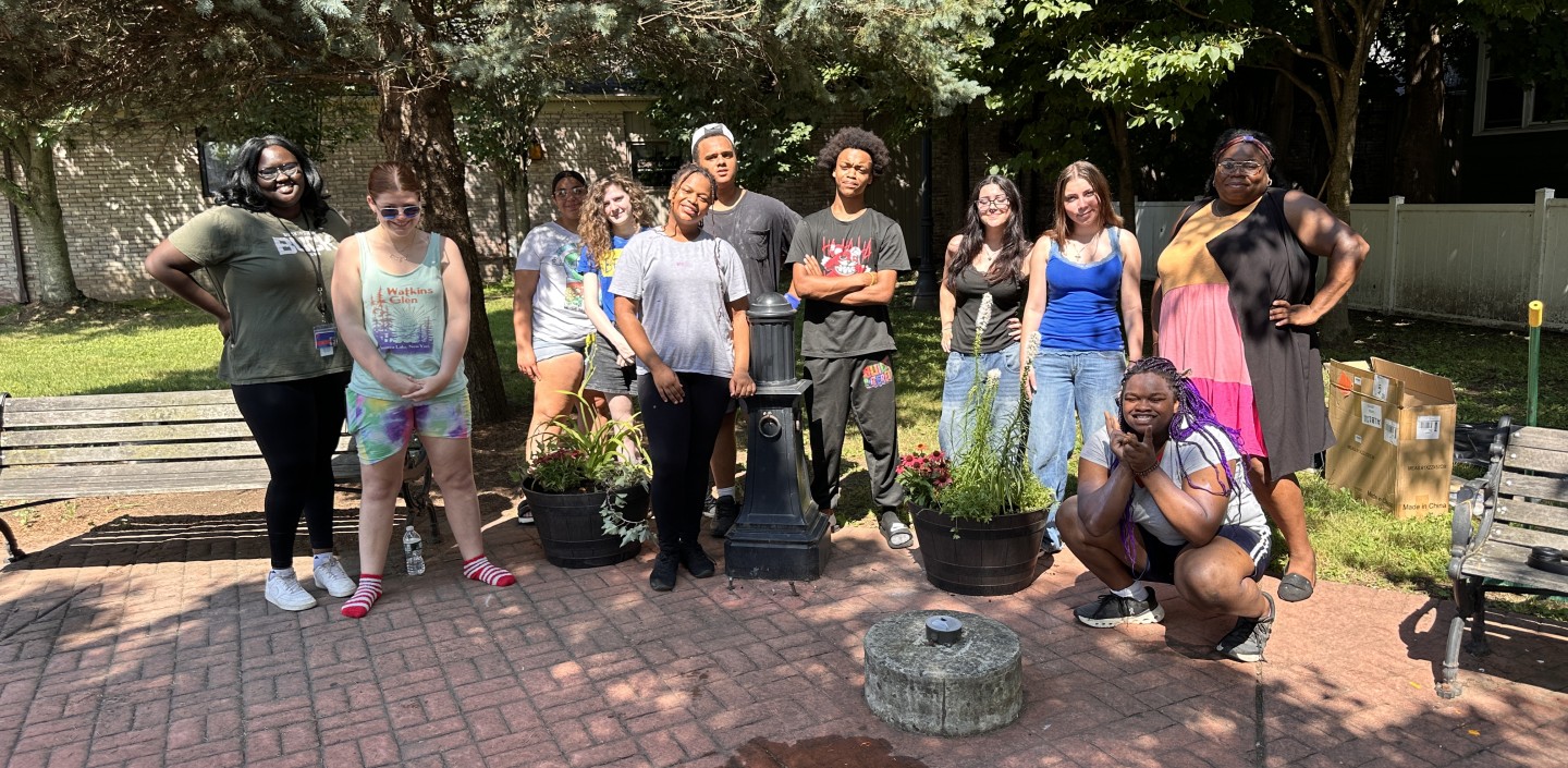 youth cleaning up a garden