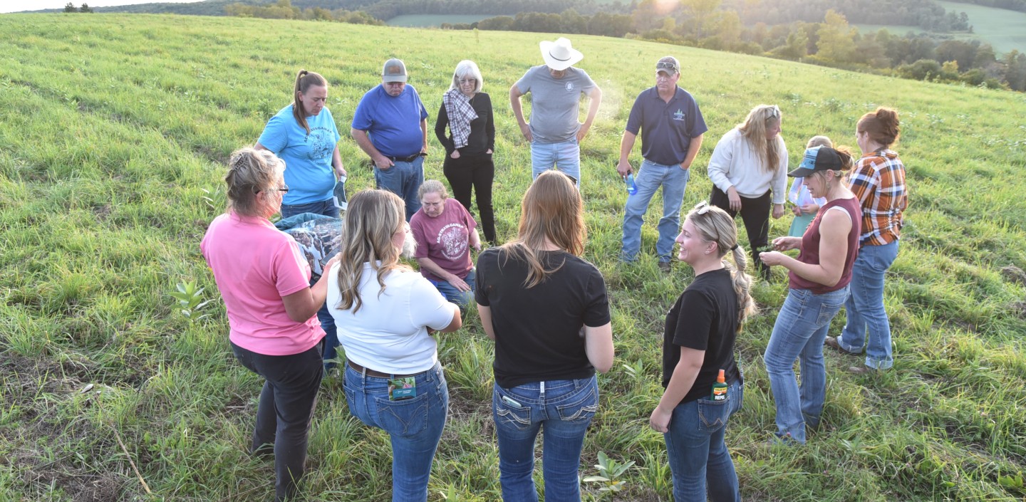 A group of farmers standing in a field