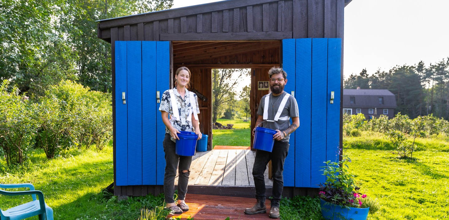 Couple standing together on their blueberry farm