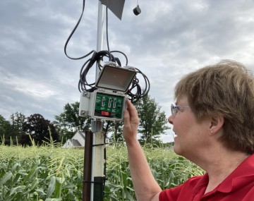 Julie checking a field monitor