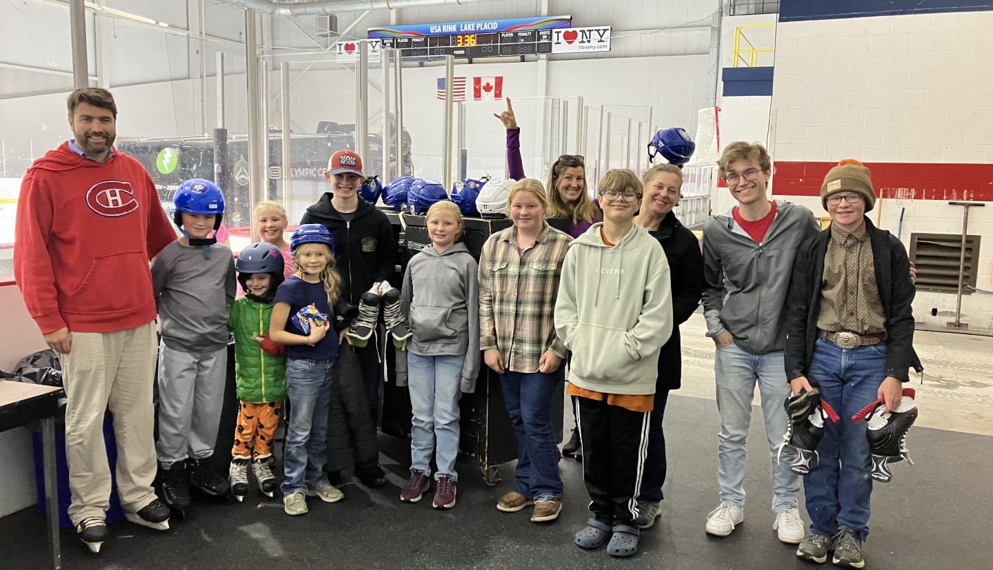 A group of teens stand together