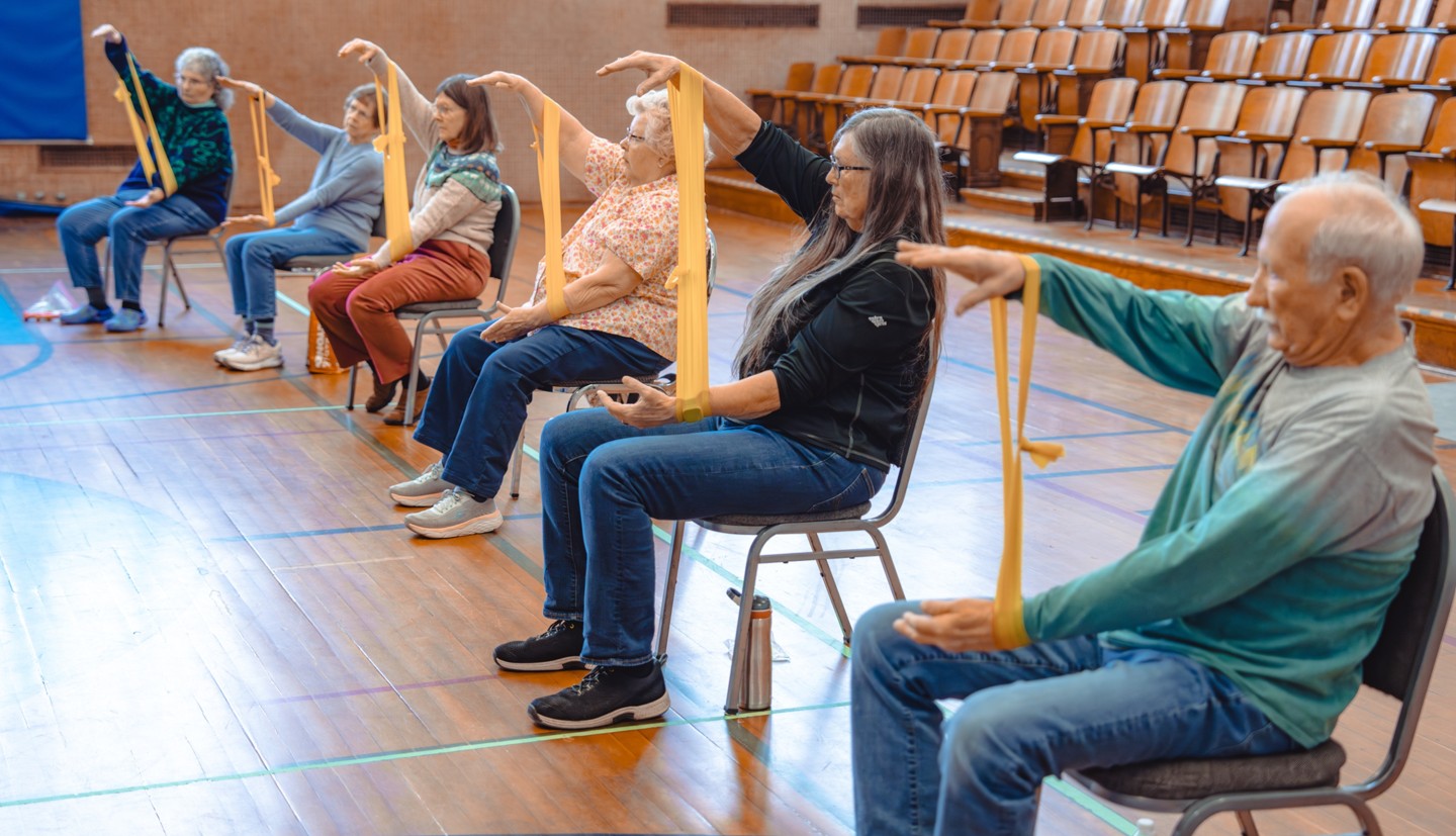 Seniors exercise in an auditorium 