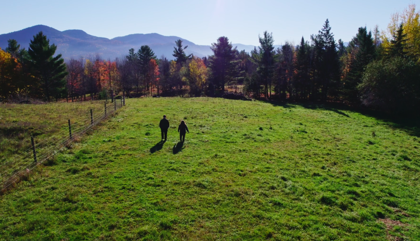 two farmers walking in a field