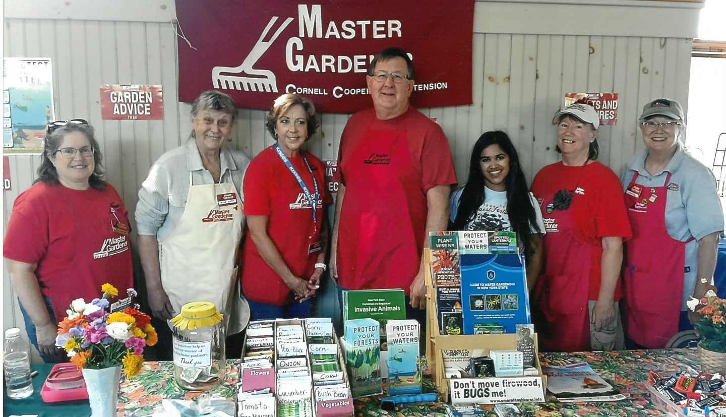 Master Gardener Volunteers staffing information table at Adirondack Harvest Festival 2024.