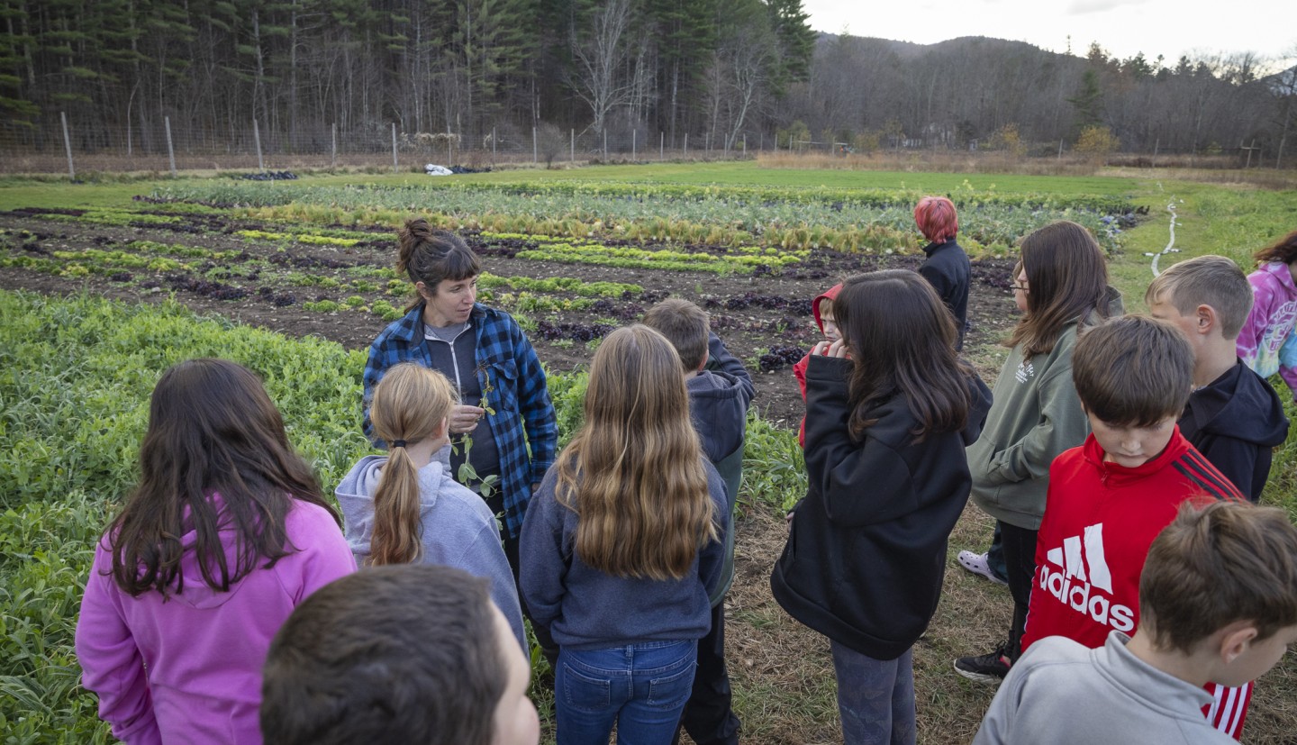 farmer teaching students about farming