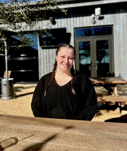 Girl sitting at a picnic table