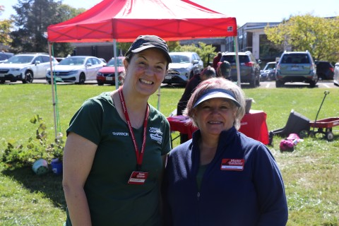 Two Master Gardeners Volunteers standing side by side at the Master Gardener Plant Sale at SUNY Ulster in 2025.