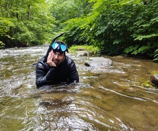 Picture of Matt Savatgy in a stream