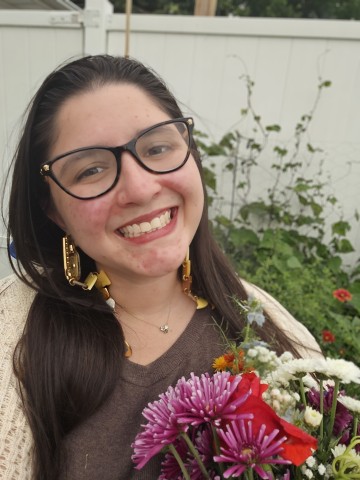 Collen Tully holding a bouquet of flowers