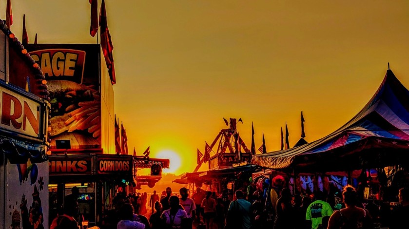Orleans County 4-H Fair midway at sunset. 