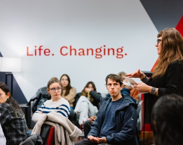 Close up of Cornell Faculty speaking at event