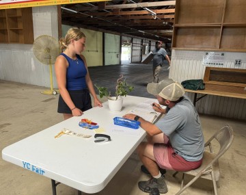 Youth talking about plants with adult