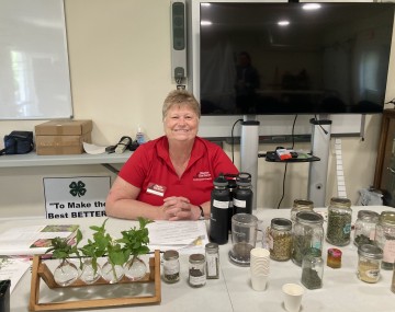 Master Gardener manning a table.
