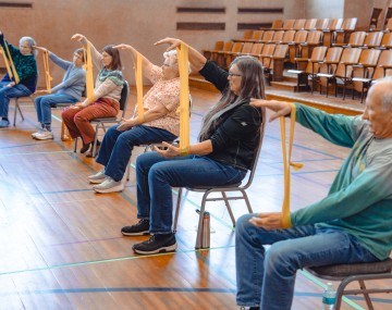 Seniors exercise in an auditorium 