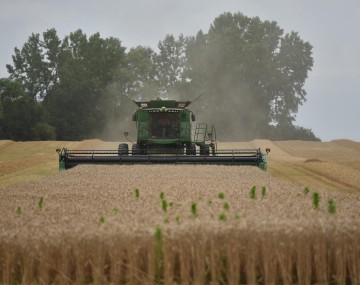 A man operating a hay bailer 