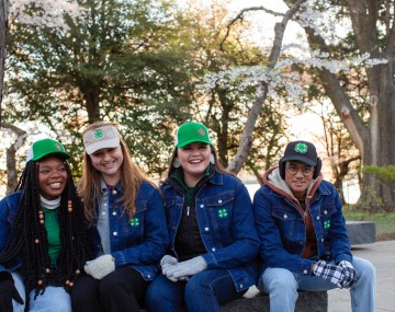 4 youth seated together