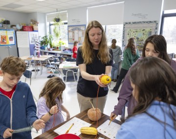 educator and kids learning about squash