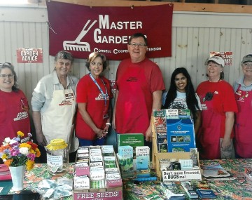 Master Gardener Volunteers staffing information table at Adirondack Harvest Festival 2024.