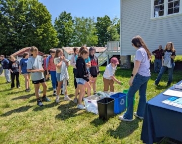 students learning about trash and recycling