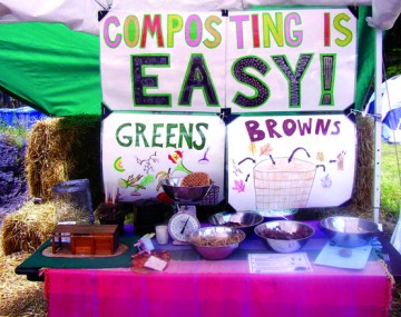 An information table with large, handmade sign reading Composting is easy!