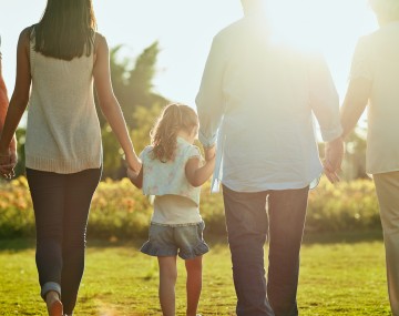 a family walking hand in hand