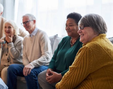 A group of adults sitting and talking