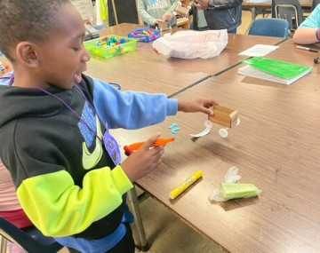 A child building a homemade race car