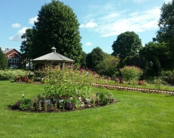 gazebo surrounded by flowers