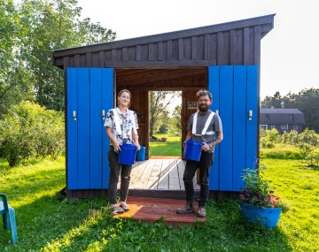 Couple standing together on their blueberry farm
