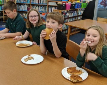 Youth eating pankcakes